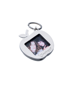 SomethingSoft silver apple photo keychain with a two-person photo insert on a white background